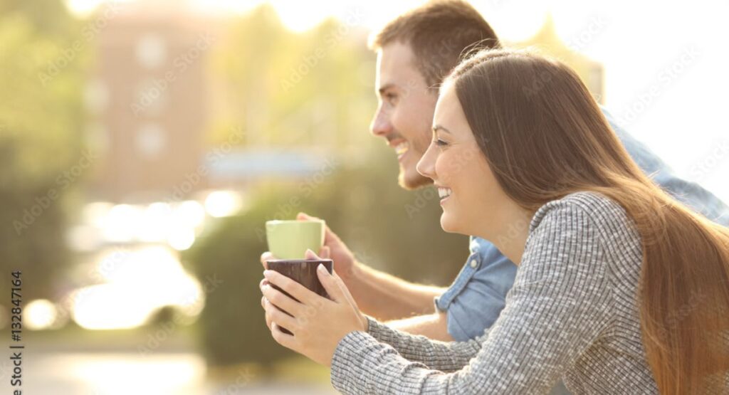 Romantic couple sharing good morning wishes during a cozy sunrise, showing love and emotional connection.