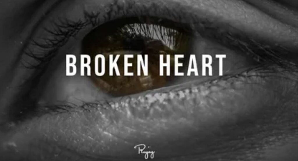 A broken soul hiding silent pain behind tired eyes, carrying the weight of love that ended but never truly faded away.